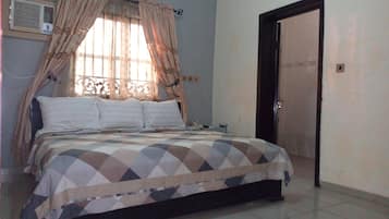 Minibar, desk, blackout curtains, iron/ironing board