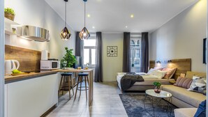 A modern apartment with a kitchen, dining area, and living room. - Number 1 Deluxe Apartments (Rijeka)