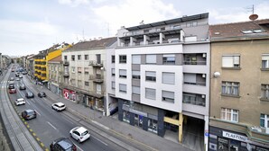 A multi-story building with a ground-level store and upper-floor residential units. - Apartment Tatjana (Zagreb)