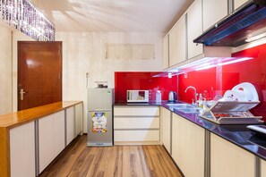 Microwave, oven, coffee/tea maker, dining tables