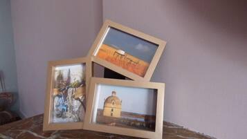Three framed pictures on a marble surface.