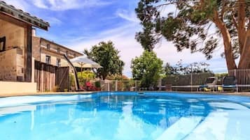Seasonal outdoor pool, a heated pool, pool loungers