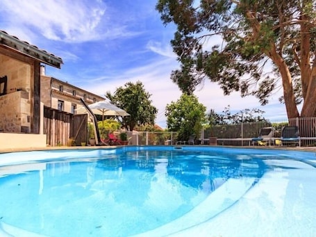 Seasonal outdoor pool, a heated pool, sun loungers