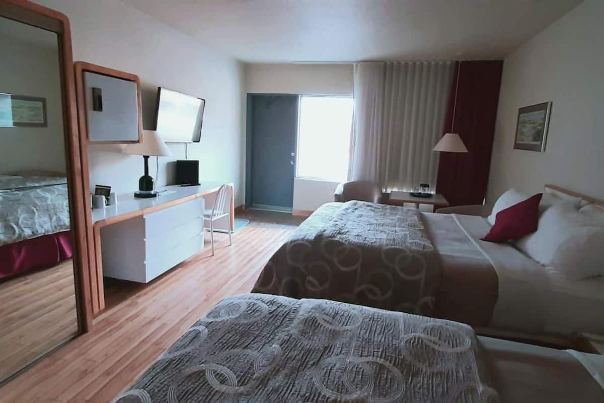 pillow-top beds, desk, blackout curtains, soundproofing