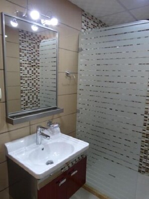 Apartment, 2 Bedrooms | Bathroom | Shower, slippers, towels, shampoo - Golden Palace Hotel Apartments (Amman)