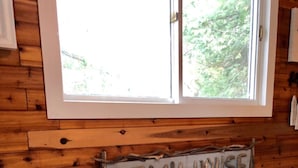 A wooden wall with a sign that reads "BEACH HOUSE". - Quaint, Clean & Updated Cottage- Steps From The Beach. (Port Franks)