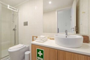Shower, hair dryer, towels, soap