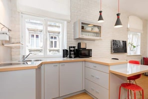 Fridge, microwave, stovetop, coffee/tea maker