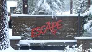 A brick wall with the word 'ESCAPE' painted in red. - Steps from Snow Summit Resort! Ski-In Ski-Out! Wifi & Cable! (Big Bear Lake)