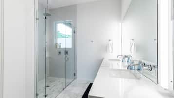 Combined shower/tub, hair dryer, towels, soap