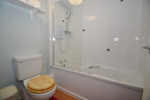 Combined shower/tub, hair dryer, towels, soap