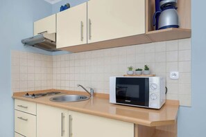 Fridge, microwave, stovetop, coffee/tea maker