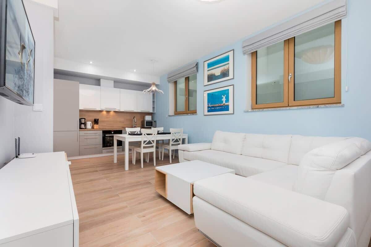 Living room with a comfortable sofa and TV. 