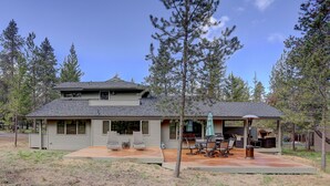 A two-story house with a covered patio and a deck. - 16 Yellow Pine - Gorgeous Golf Course, Covered Outdoor Living, Hot Tub, 3 King bedrooms, Bocce (Bend)