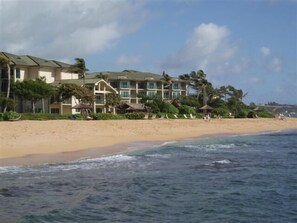 On the beach, sun-loungers