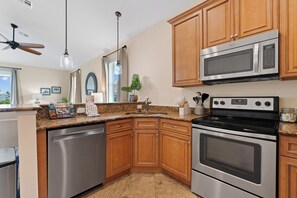 Fridge, microwave, stovetop, dishwasher - Sea la Vie offers Bay Views, Pool, and is Pet Friendly (Fort Myers Beach)