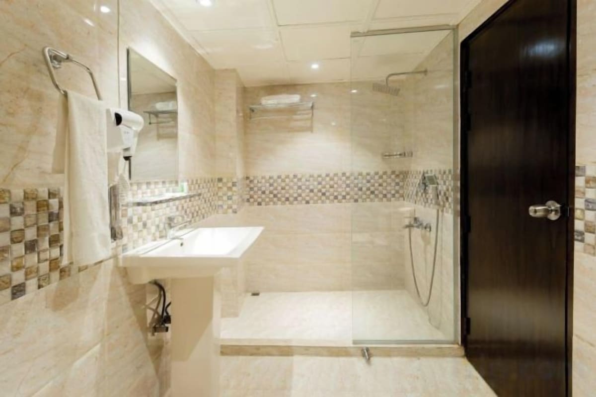 Shower, rainfall showerhead, eco-friendly toiletries, slippers