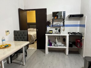Fridge, microwave, stovetop, coffee/tea maker