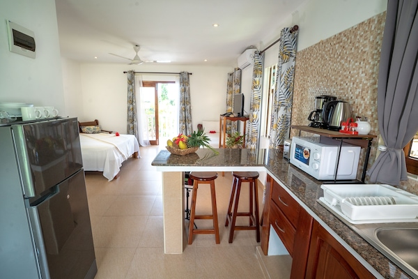 Full-sized fridge, microwave, stovetop, coffee/tea maker