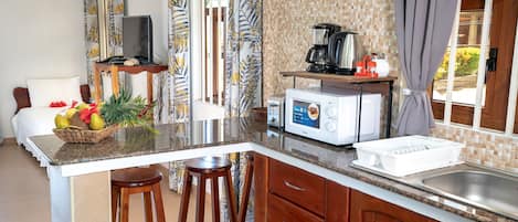 Full-sized fridge, microwave, stovetop, coffee/tea maker