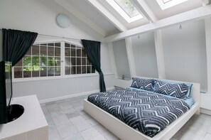 Upstairs Guest Bedroom with a Queen size bed.