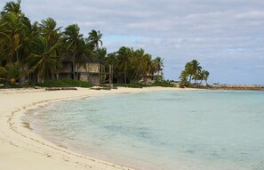 On the beach, sun loungers, beach towels - Buttercup Family Cottage beautiful beach, great snorkeling spot across the road (Georgetown)