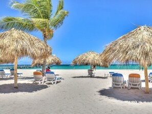 On the beach, sun-loungers, beach towels
