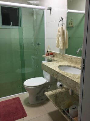 Shower, hair dryer, towels, toilet paper
