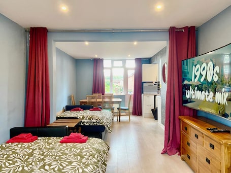 1 bedroom, desk, iron/ironing board, travel cot. Immaculate hi-spec apartment, sleeps 6. Free wifi, secure garden, free parking.