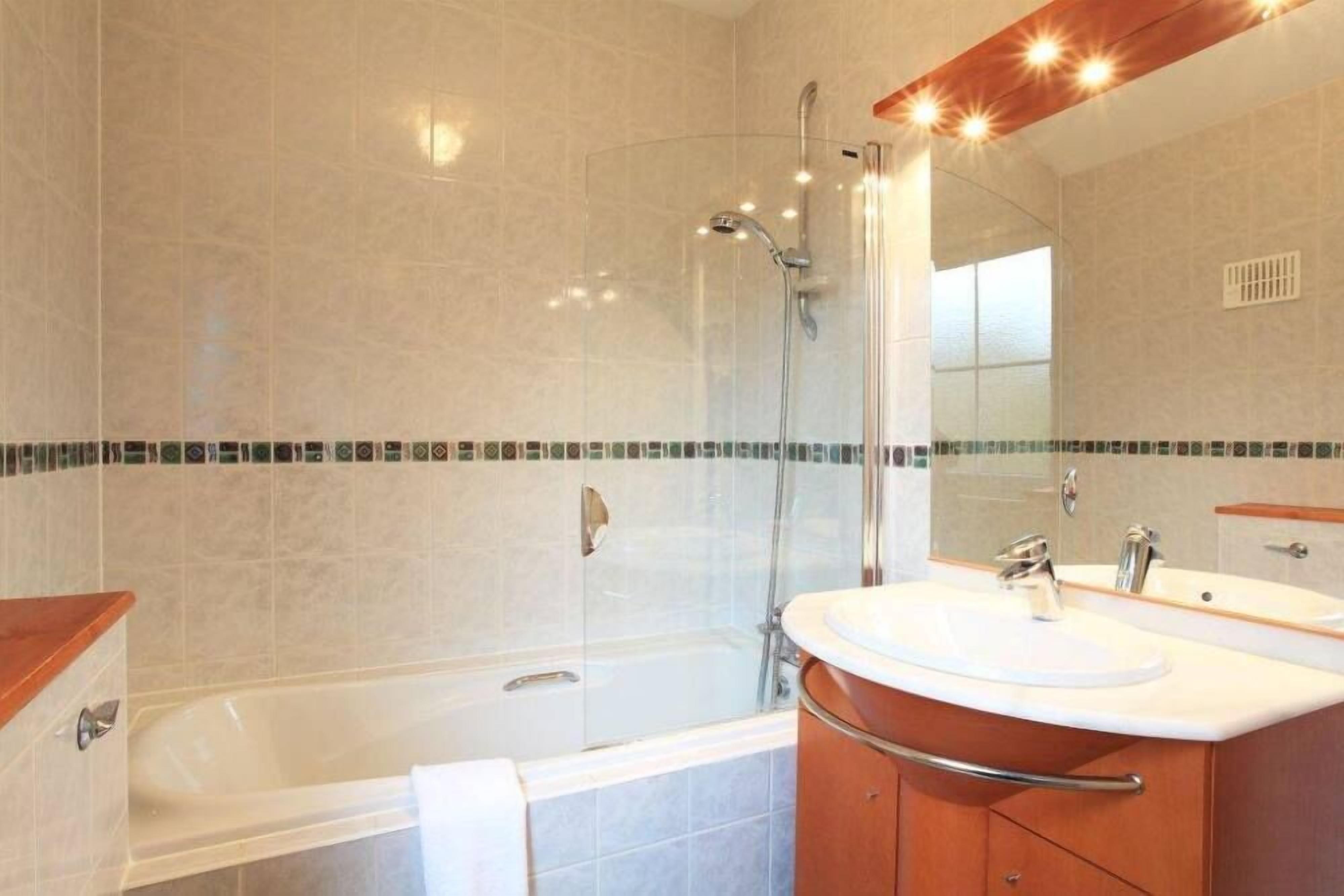 Combined shower/tub, hair dryer, towels, toilet paper