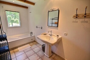 Bathtub, hair dryer, toilet paper
