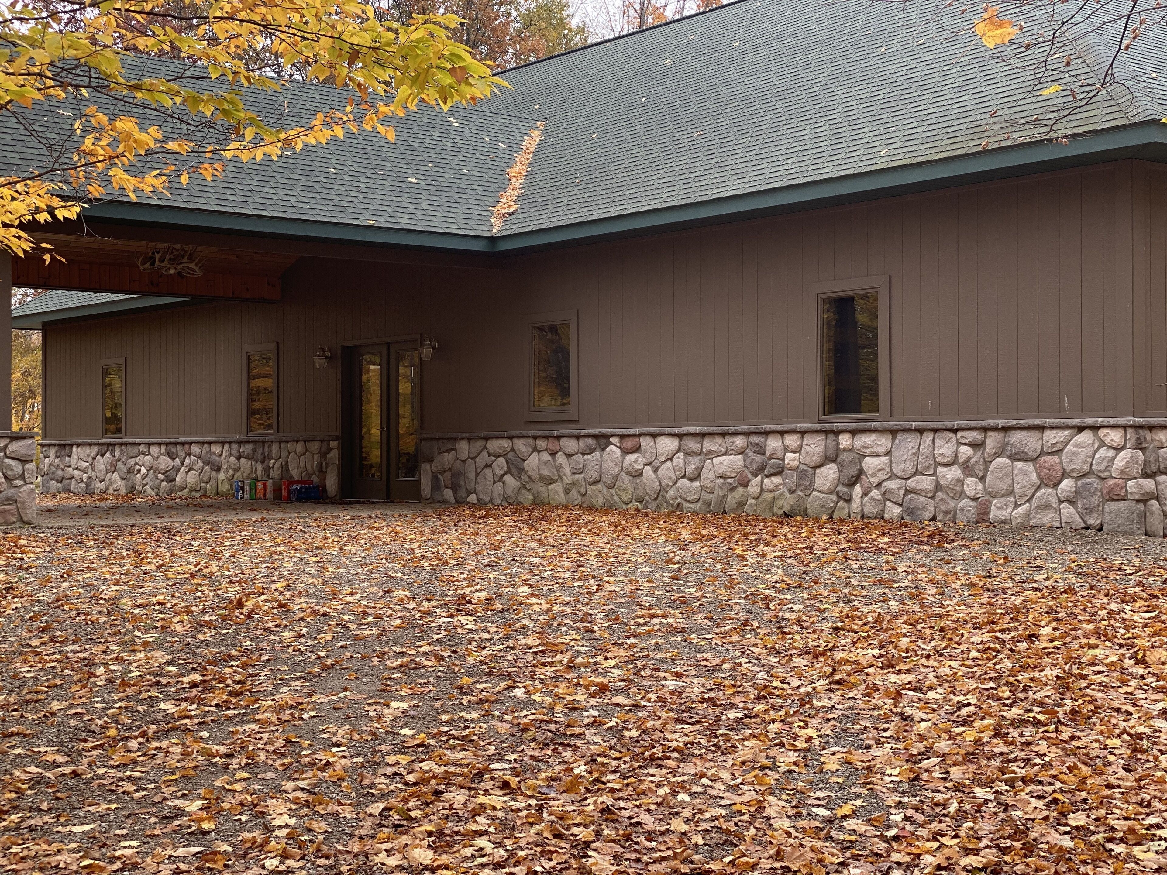 A building with a stone foundation and a wooden upper structure.