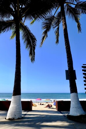 On the beach, sun loungers, beach towels