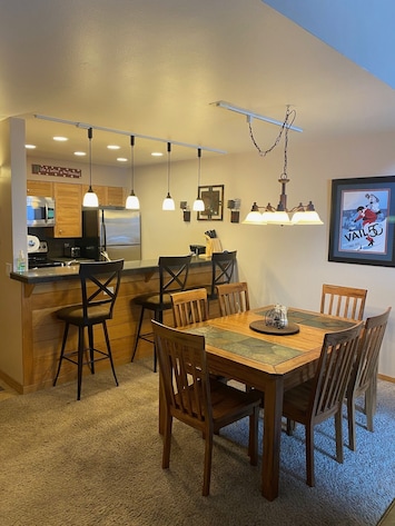 Main Dining Area & Kitchen Space in Background