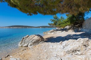 On the beach, sun loungers, beach towels
