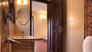 A bathroom with a wooden sink, a mirror, and a toilet. - The place to stay when you are in New Delhi (New Delhi)
