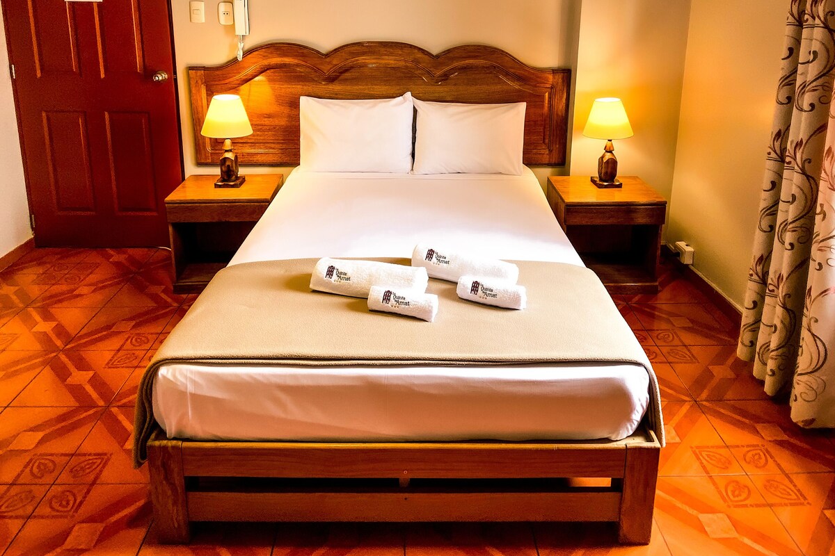 Premium bedding, desk, laptop workspace, blackout curtains