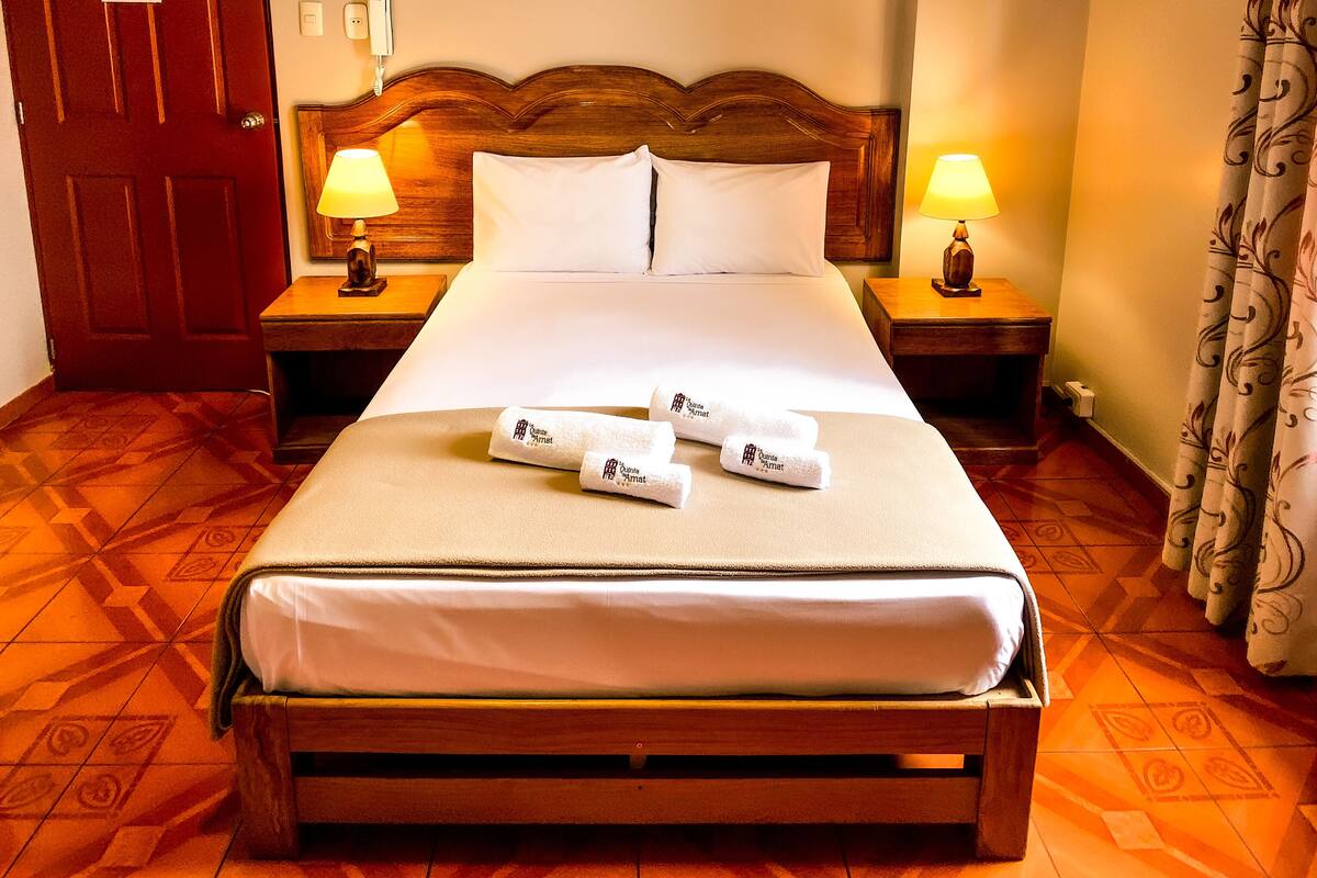 Premium bedding, desk, laptop workspace, blackout curtains
