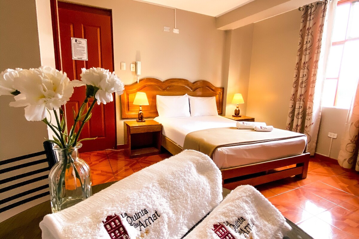 Premium bedding, desk, laptop workspace, blackout curtains