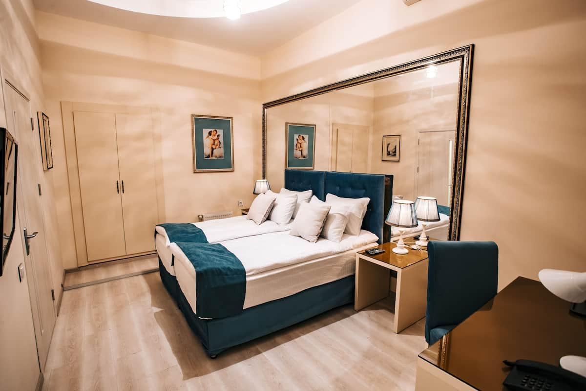 Standard Double or Twin Room | Minibar, in-room safe, desk, blackout drapes