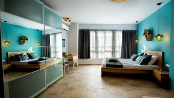 A modern bedroom with a bed, a desk, and a chair. There is a large mirror and a window with curtains.