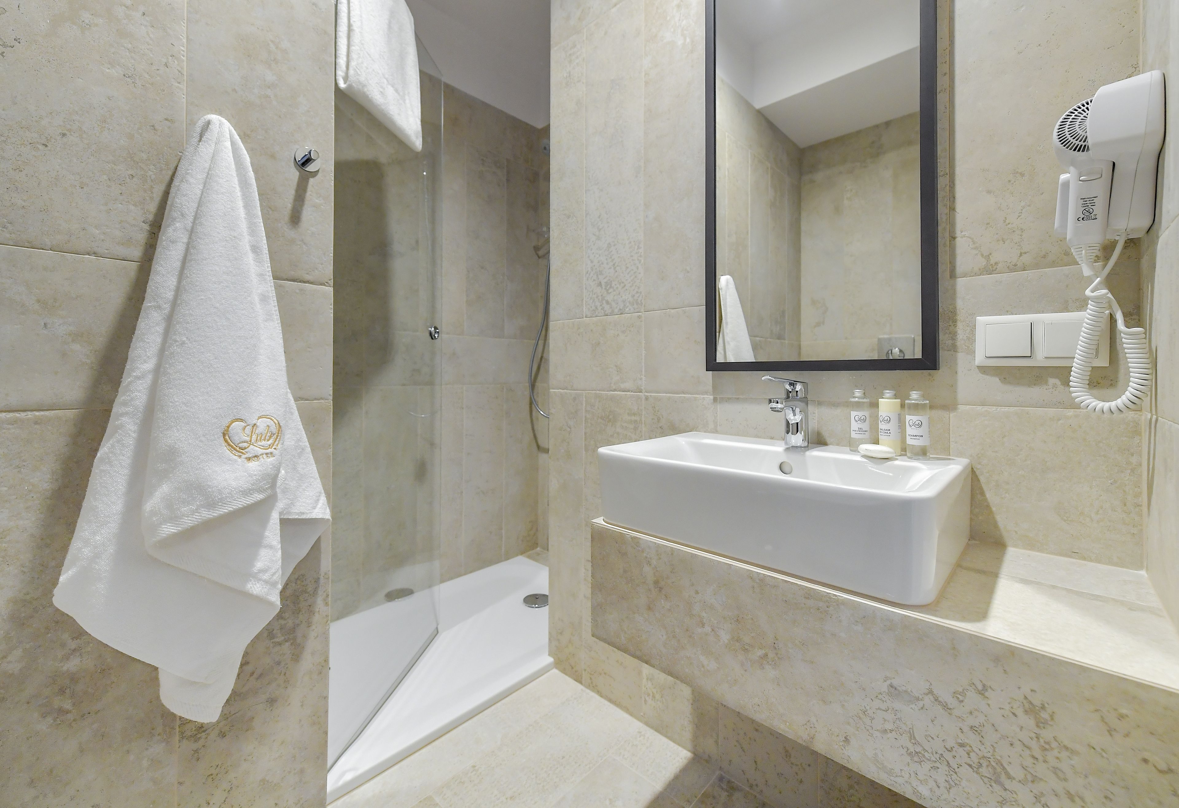 shower, free toiletries, hair dryer, towels