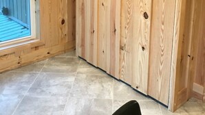 A room with wooden walls, a window with blinds, and a tiled floor. - Fun Seekers Getaway!!!! (Hot Springs)