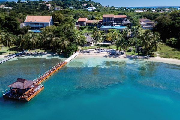 Drone view of the luxurious villa, Solamente & the nearest beach to our villa