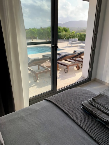 Modern luxury villa w/ stunning views, private heated pool + roof terrace