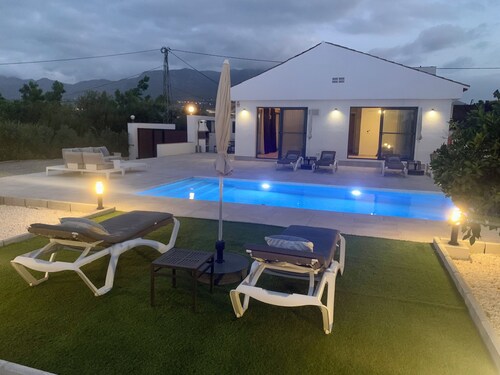 Modern luxury villa w/ stunning views, private heated pool + roof terrace