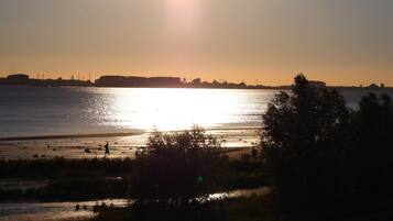 Enjoy serene views of a tranquil lake or river from this peaceful setting.