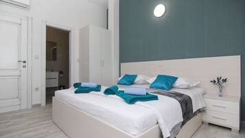 3 habitaciones, tabla de planchar con plancha y cuna de viaje