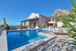 Outdoor pool, a heated pool, pool loungers