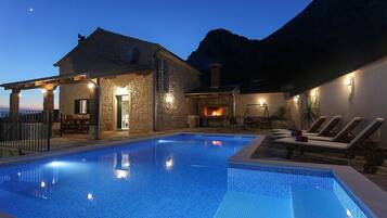 Outdoor pool, a heated pool, sun loungers